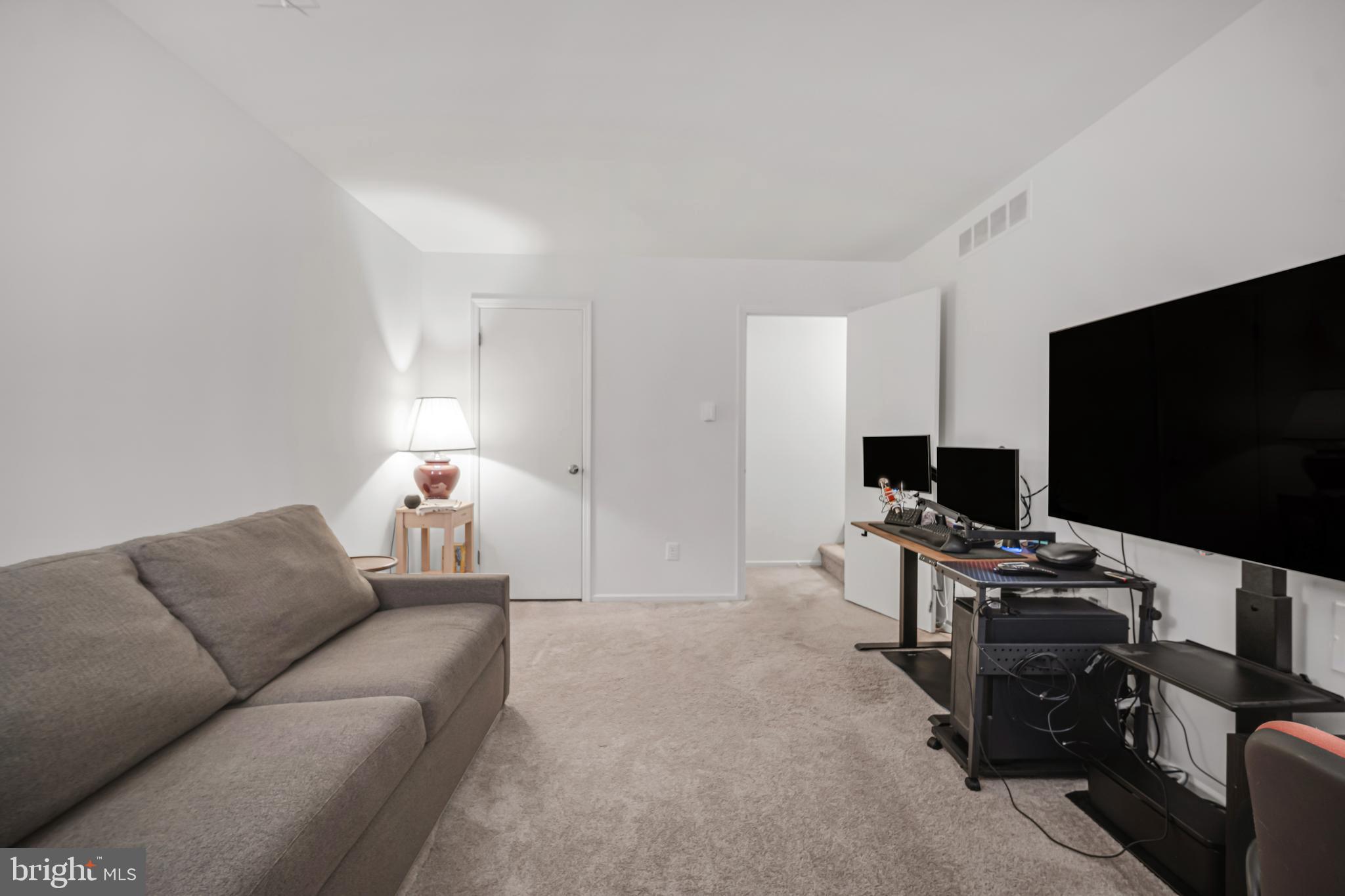 604 Wrensong Road Yardley, PA 19067 - Photo 25 of 37 a living room with furniture and a flat screen tv