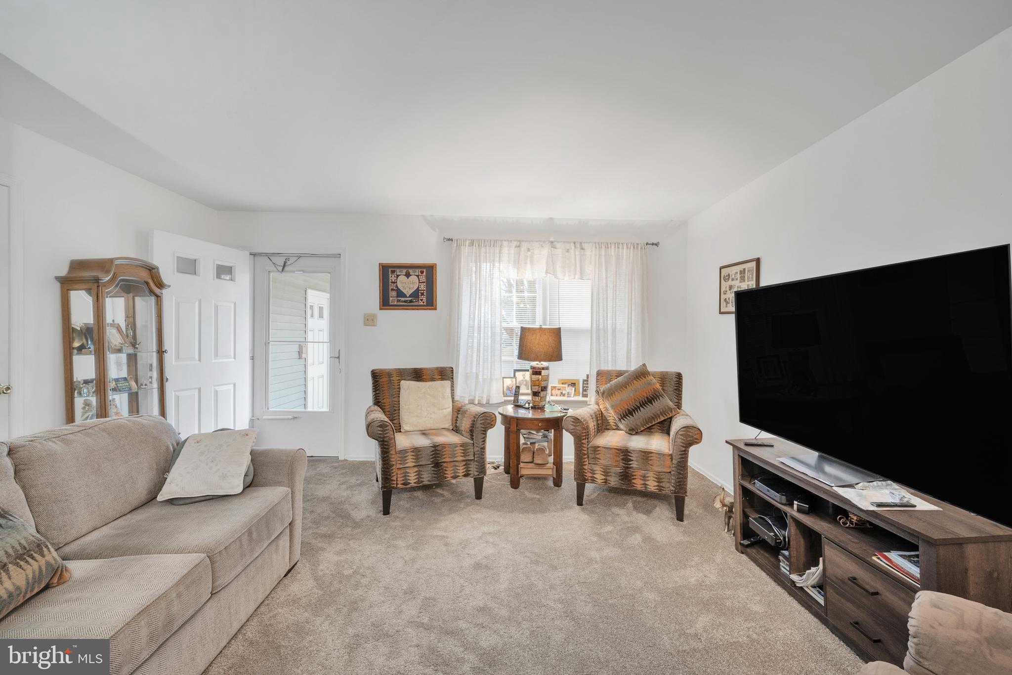 604 Wrensong Road Yardley, PA 19067 - Photo 26 of 37 a living room with furniture and a flat screen tv
