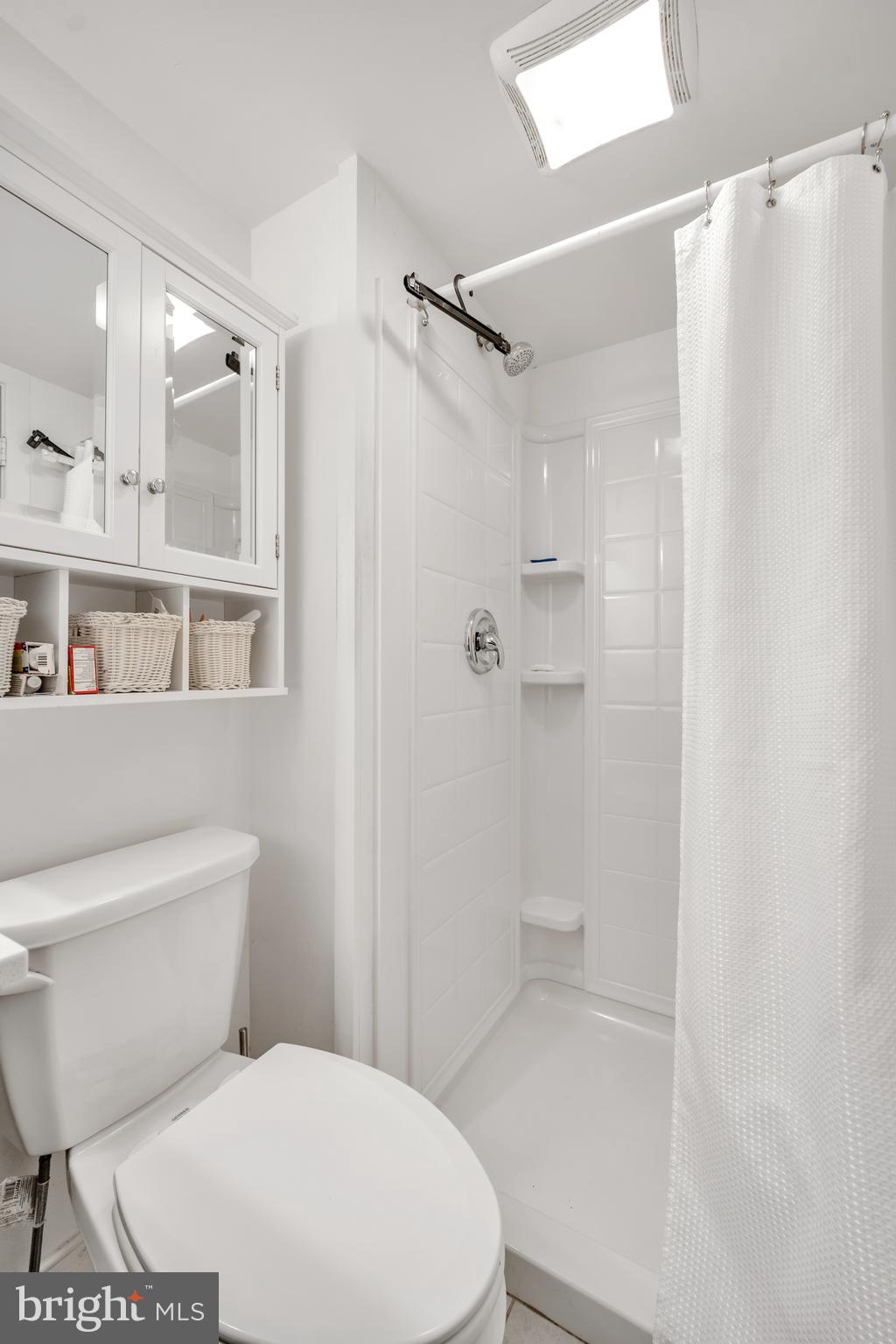 604 Wrensong Road Yardley, PA 19067 - Photo 35 of 37 a white toilet sitting next to a bathroom sink