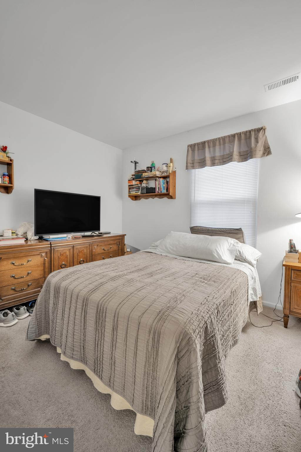 604 Wrensong Road Yardley, PA 19067 - Photo 36 of 37 a bedroom with a bed and window