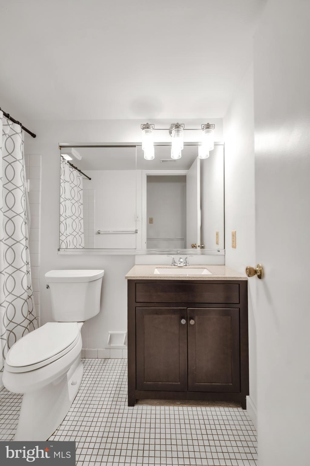 604 Wrensong Road Yardley, PA 19067 - Photo 37 of 37 a bathroom with a sink toilet and mirror