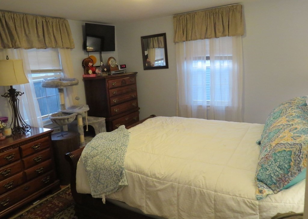 75 Colasanti Road Weymouth, MA 02191 - Photo 11 of 30 a bedroom with a bed and furniture