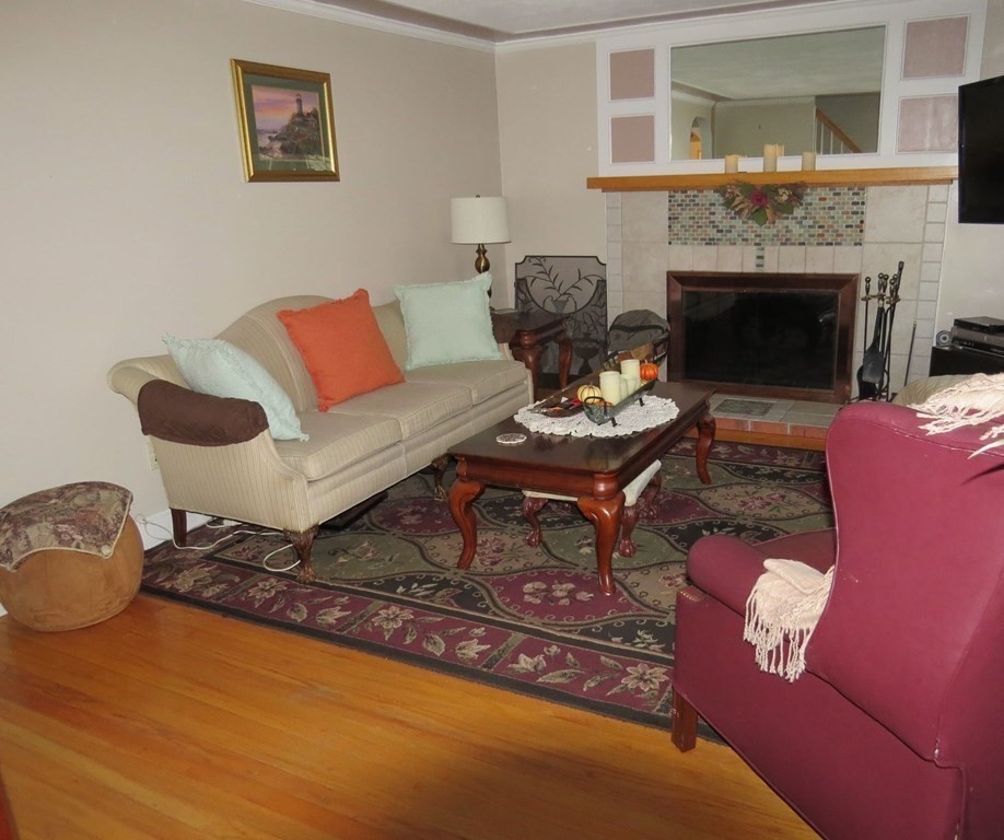 75 Colasanti Road Weymouth, MA 02191 - Photo 14 of 30 a living room with furniture and a fireplace