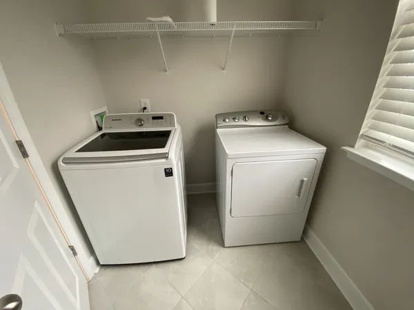 a utility room with dryer and washer