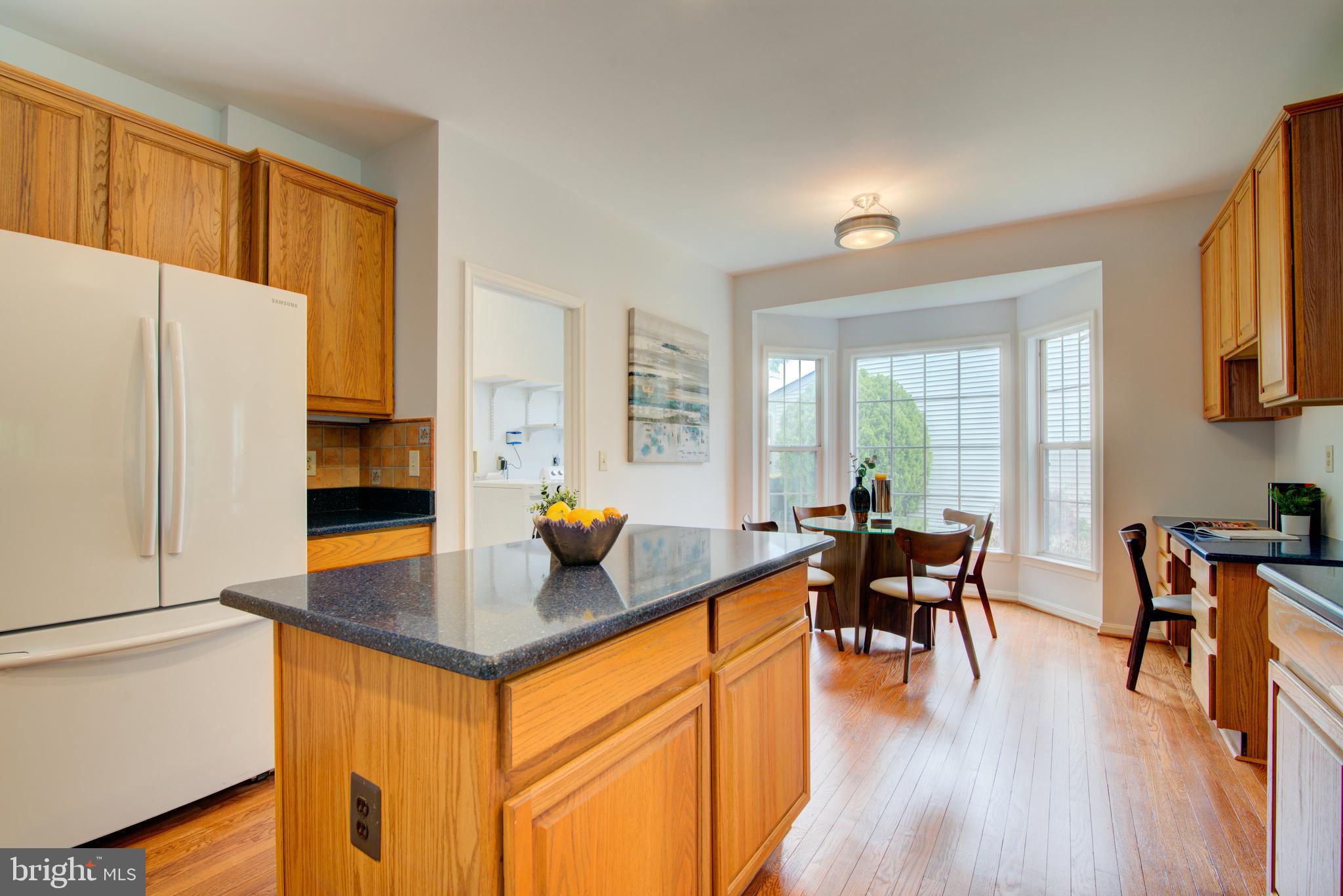 12719 Hitchcock Court Reston, VA 20191 - Photo 17 of 55 a living room with furniture and wooden floor