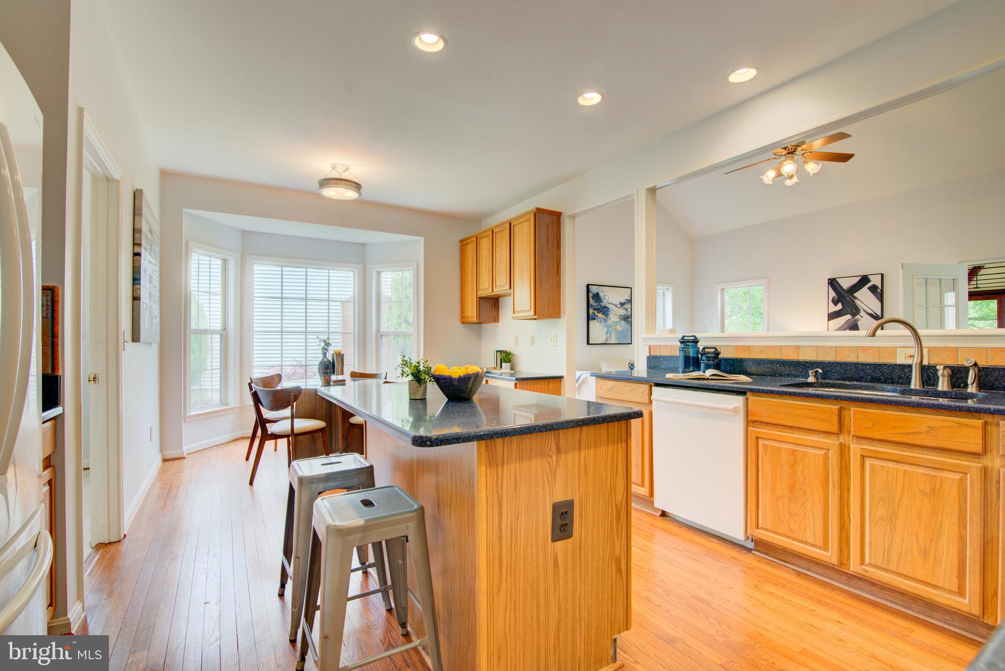 12719 Hitchcock Court Reston, VA 20191 - Photo 19 of 55 a view of a kitchen and dining room