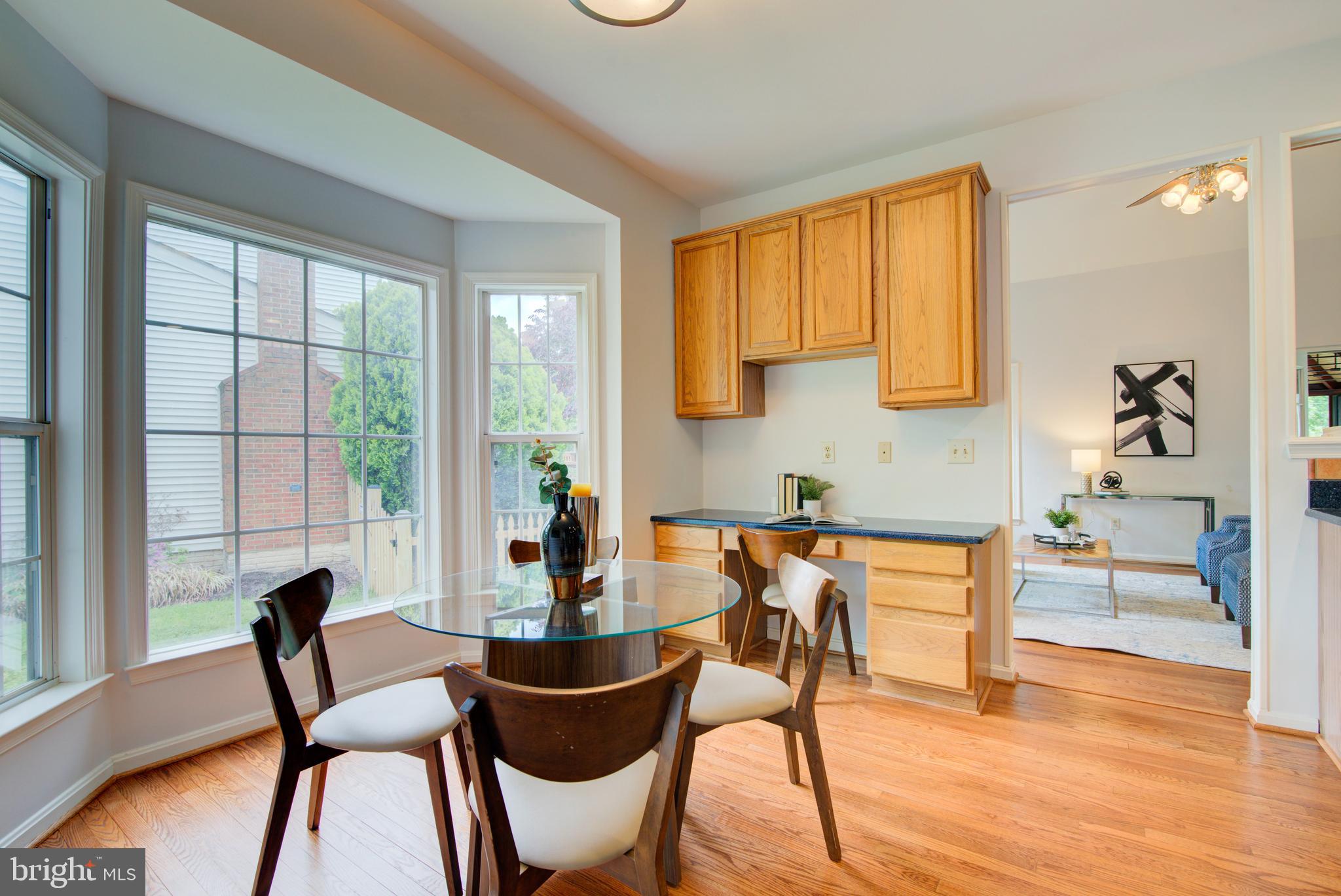 12719 Hitchcock Court Reston, VA 20191 - Photo 20 of 55 a dining room with furniture and wooden floor