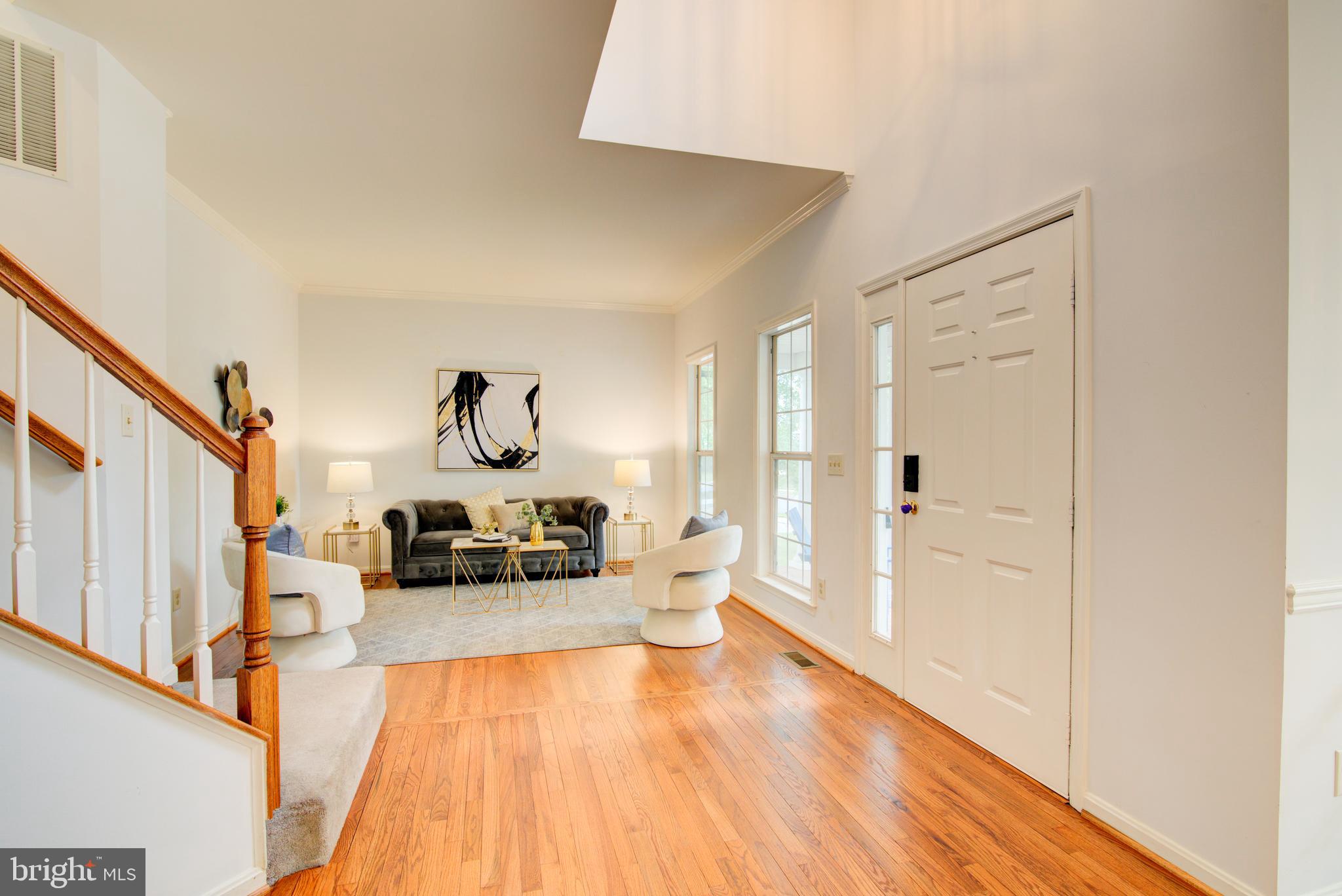 12719 Hitchcock Court Reston, VA 20191 - Photo 2 of 55 a view of a living room with furniture and a wooden floor