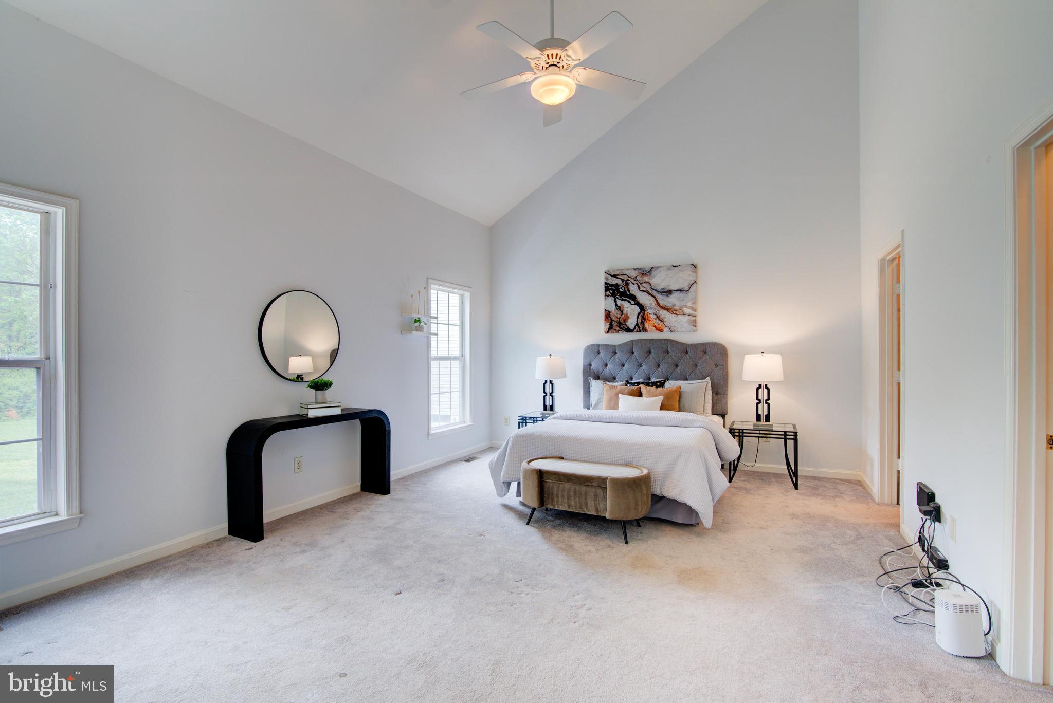 12719 Hitchcock Court Reston, VA 20191 - Photo 24 of 55 a bedroom with bed and a chandelier