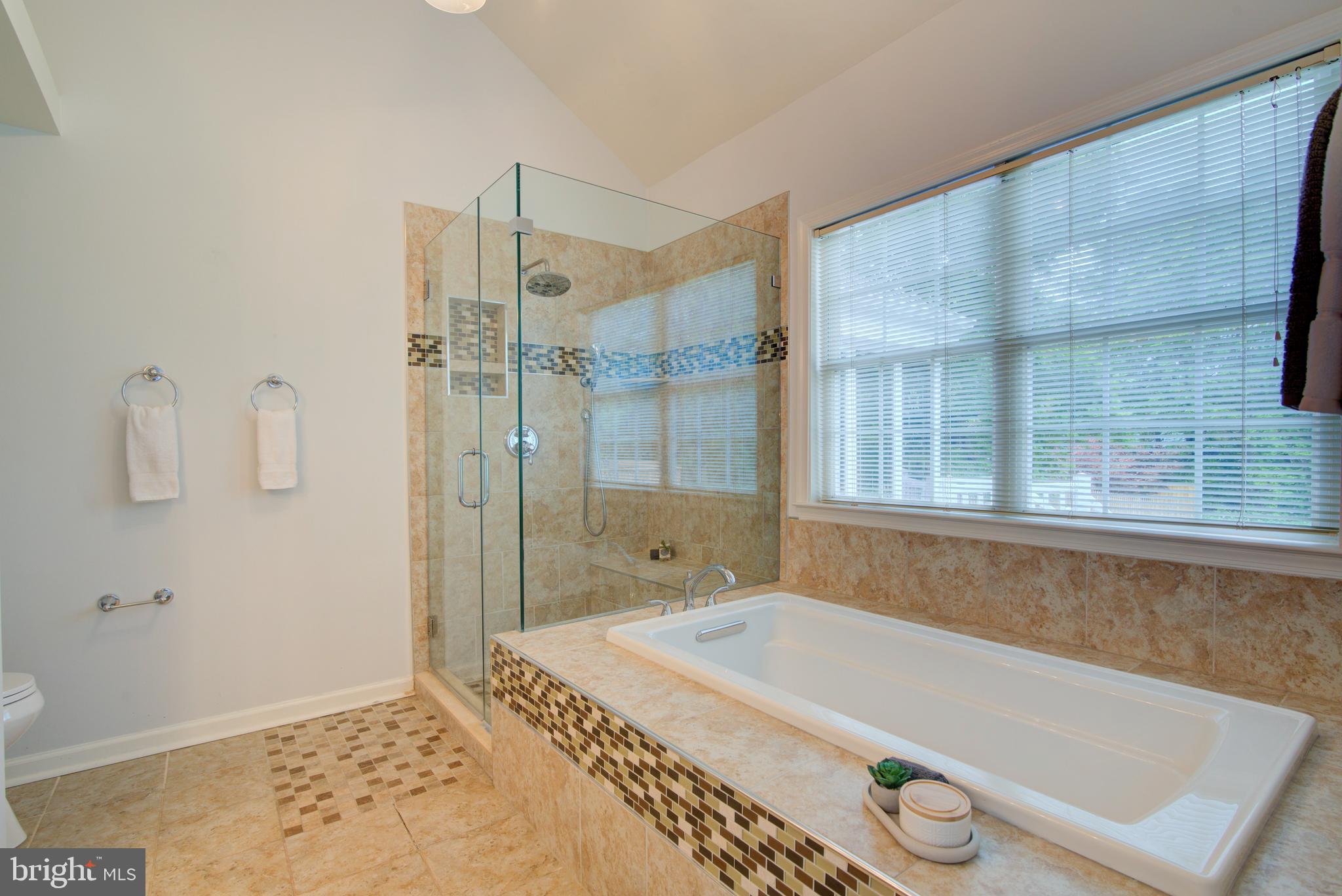 12719 Hitchcock Court Reston, VA 20191 - Photo 27 of 55 a bathroom with a tub and a shower