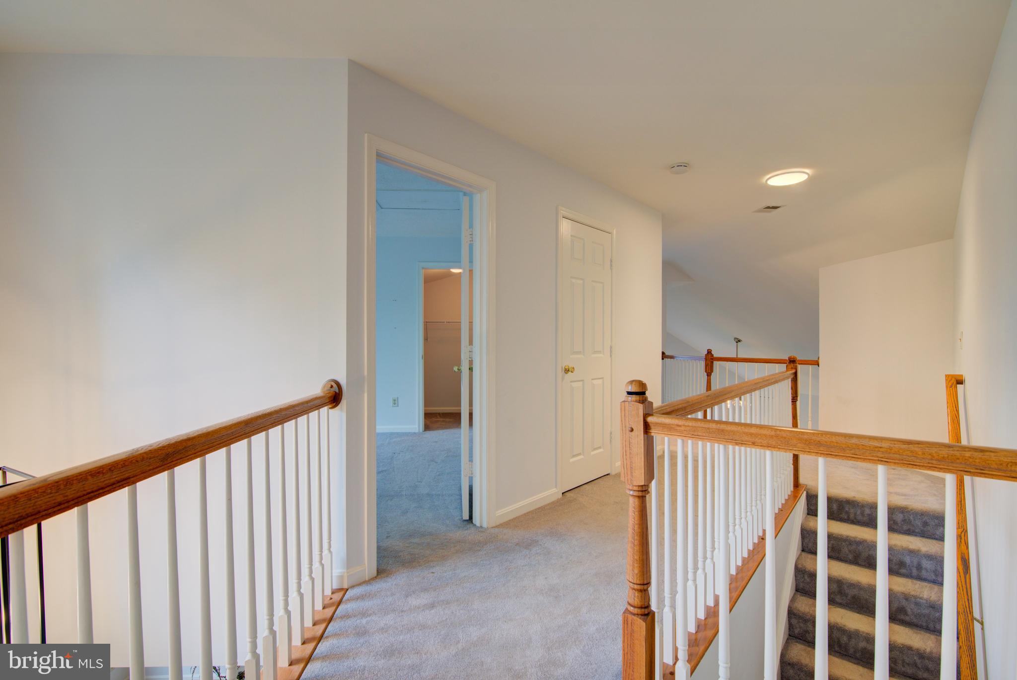 12719 Hitchcock Court Reston, VA 20191 - Photo 28 of 55 a view of a hallway with windows