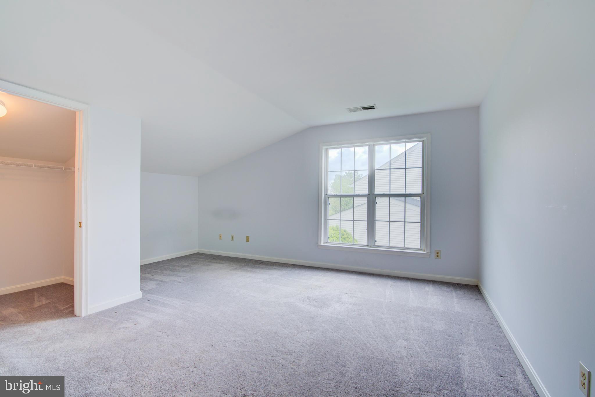 12719 Hitchcock Court Reston, VA 20191 - Photo 29 of 55 Large bedroom with walk in closet and desk nook