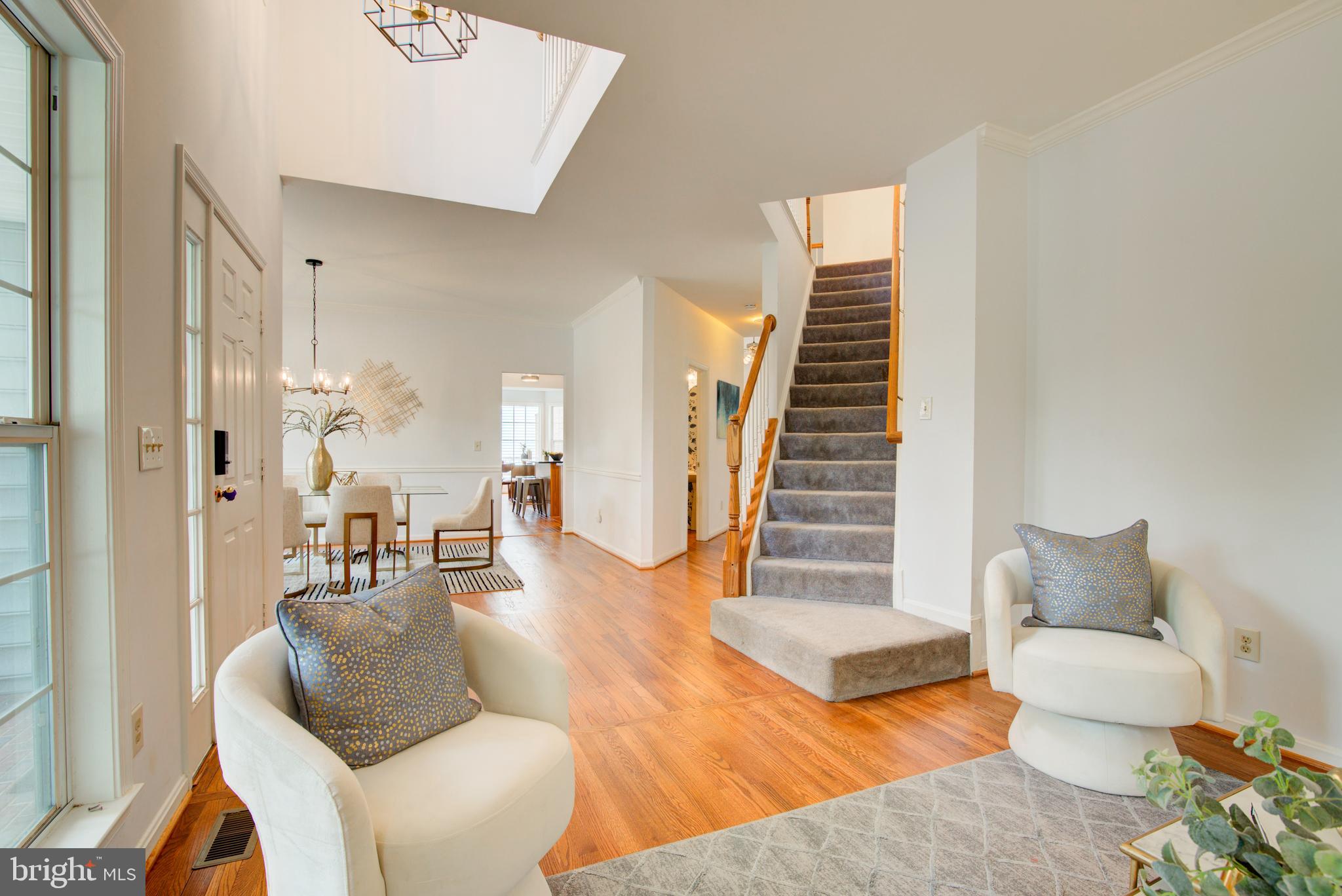 12719 Hitchcock Court Reston, VA 20191 - Photo 3 of 55 a living room with furniture and a wooden floor