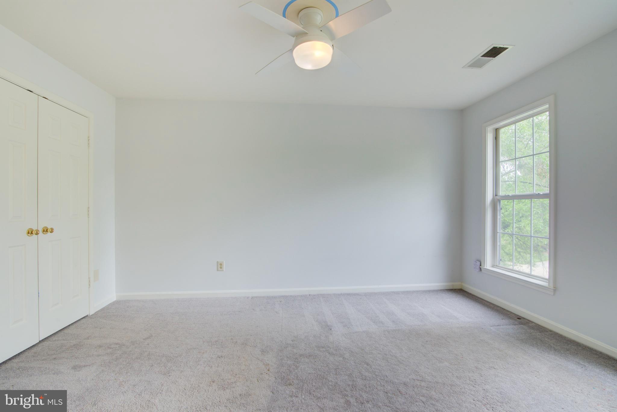 12719 Hitchcock Court Reston, VA 20191 - Photo 32 of 55 a view of an empty room with a window