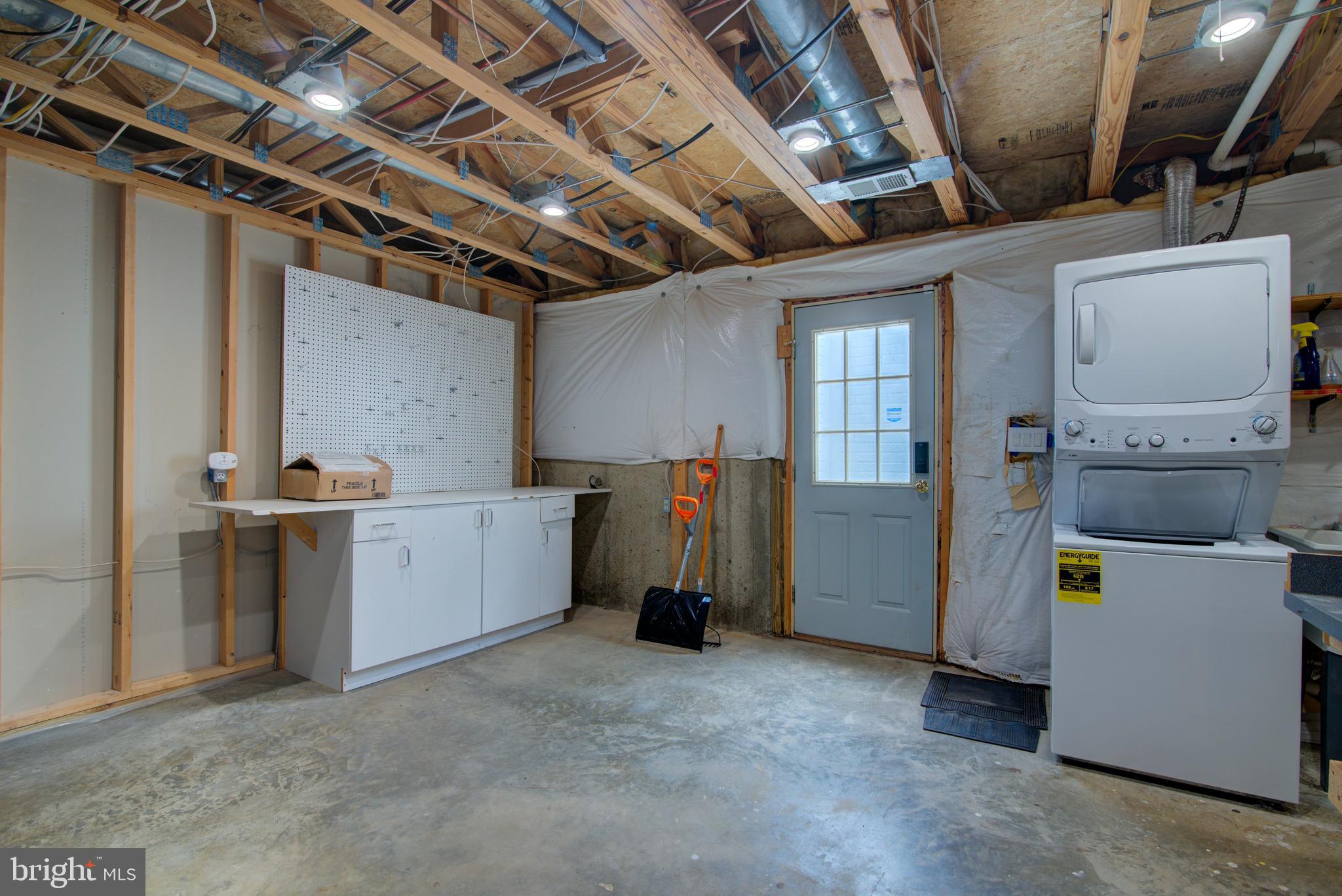 12719 Hitchcock Court Reston, VA 20191 - Photo 47 of 55 a view of a storage & utility room with washer and dryer