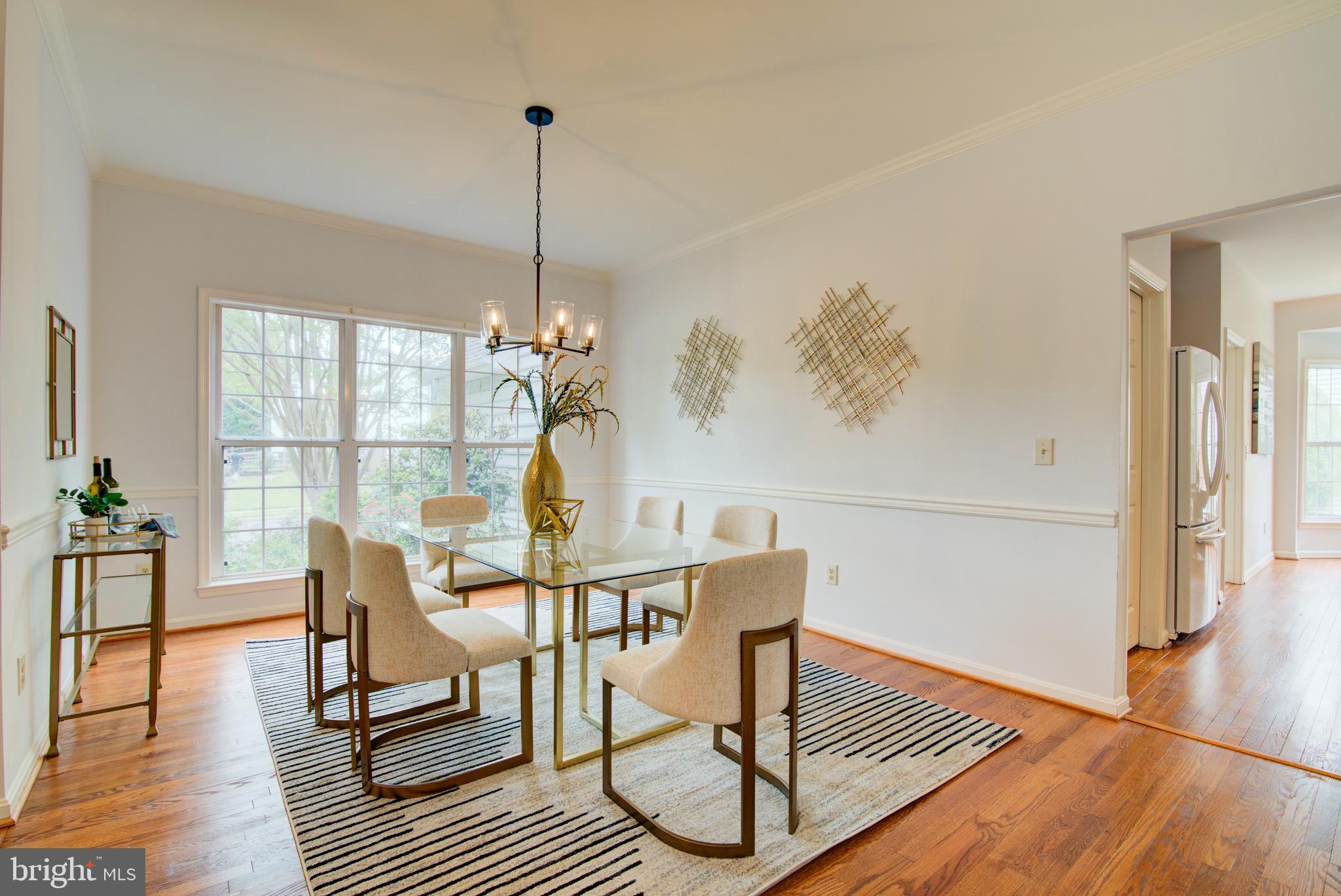 12719 Hitchcock Court Reston, VA 20191 - Photo 6 of 55 a view of a dining room with furniture window and wooden floor