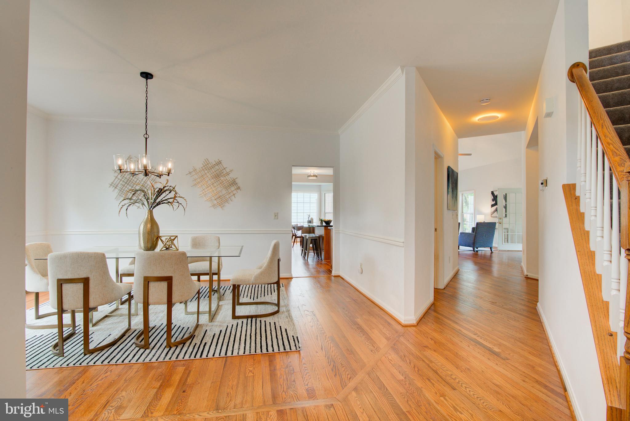 12719 Hitchcock Court Reston, VA 20191 - Photo 7 of 55 a view of a dining room with furniture and wooden floor