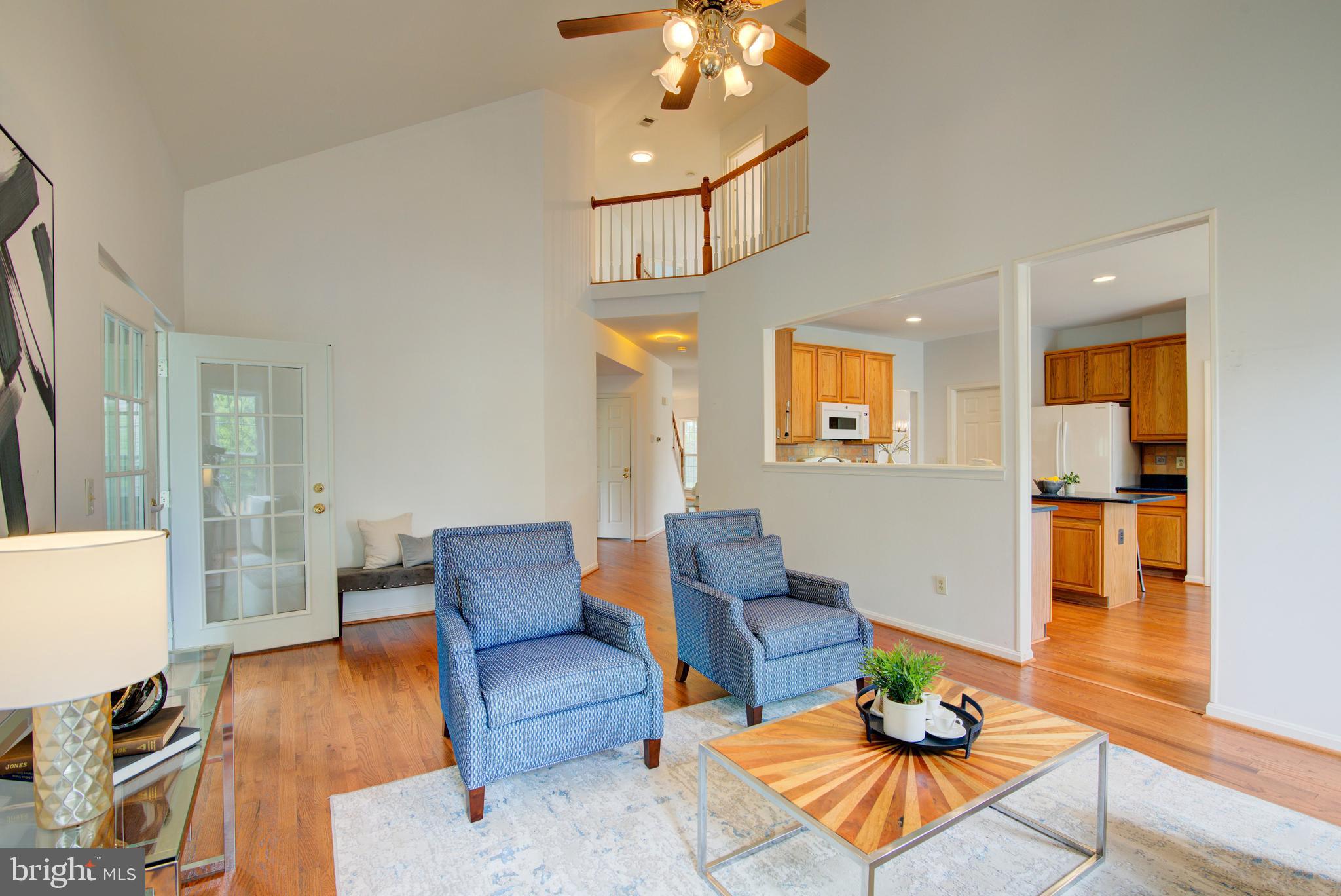 12719 Hitchcock Court Reston, VA 20191 - Photo 8 of 55 a living room with furniture and wooden floor