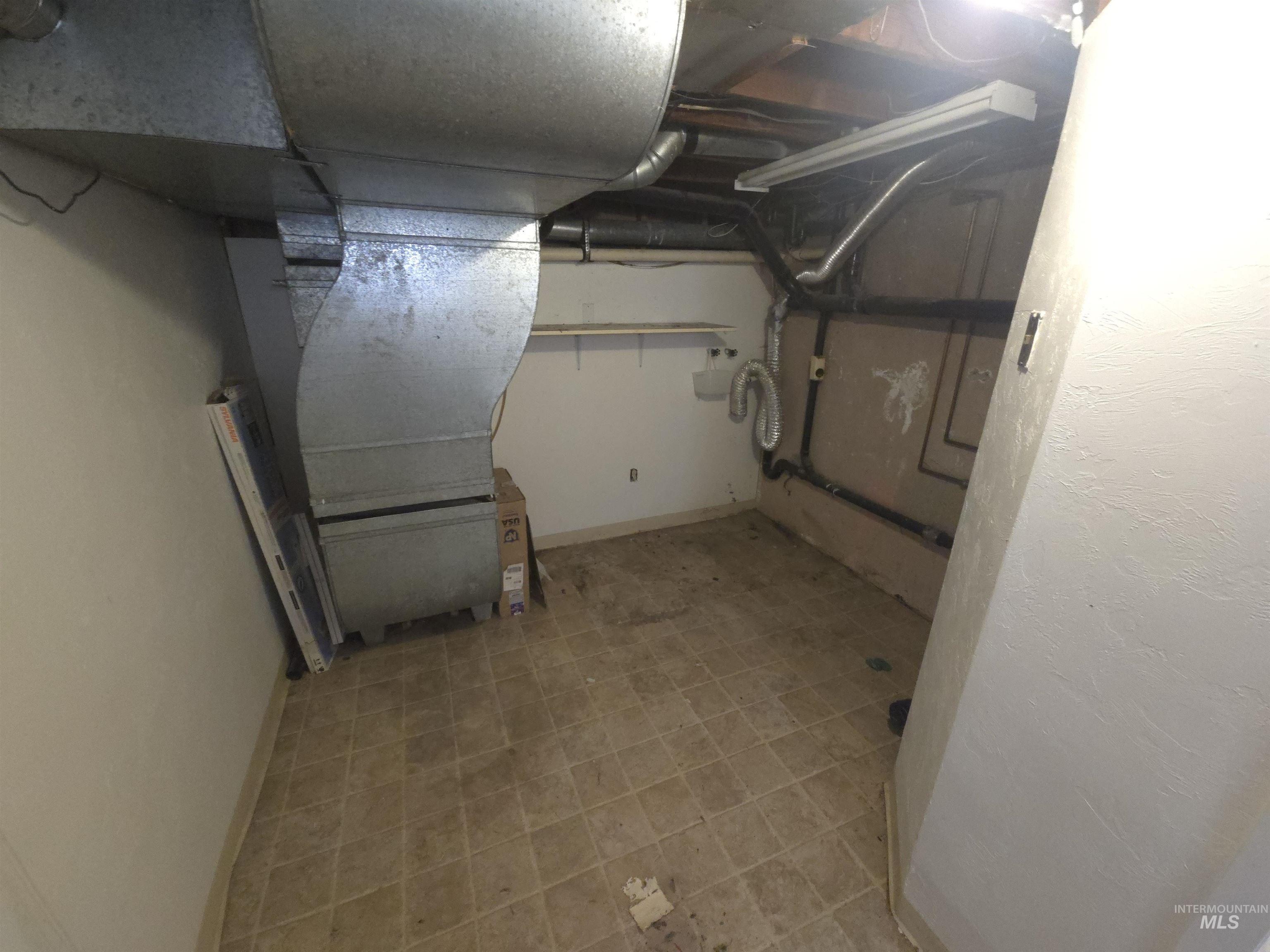 458 Rose Street North Twin Falls, ID 83301 - Photo 15 of 17 Unfinished below grade area featuring baseboards and heating unit