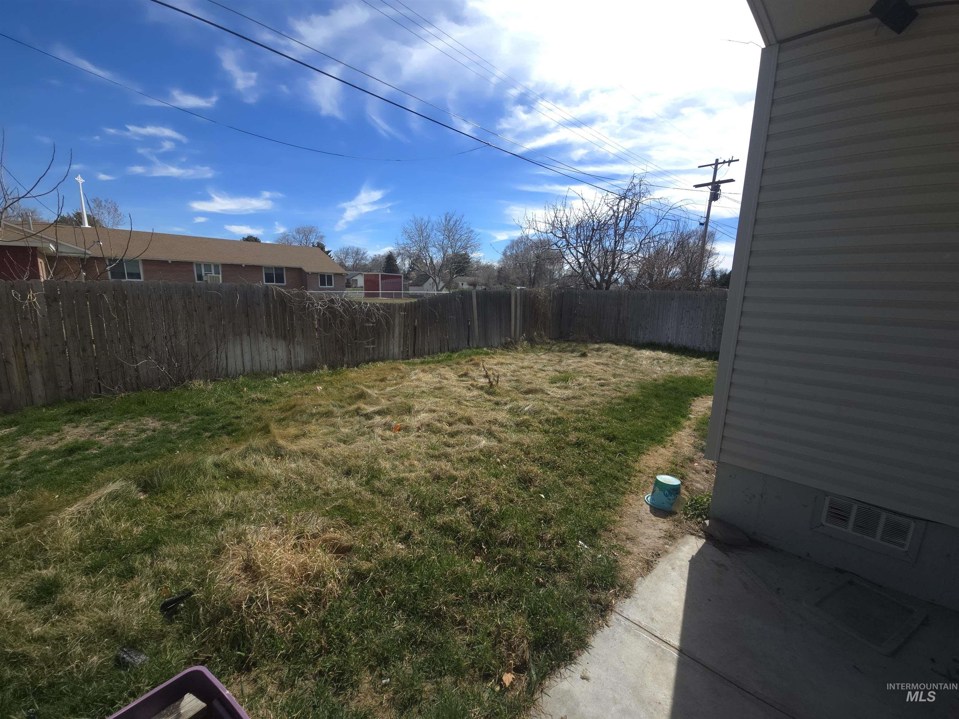 458 Rose Street North Twin Falls, ID 83301 - Photo 16 of 17 Fenced backyard featuring a patio