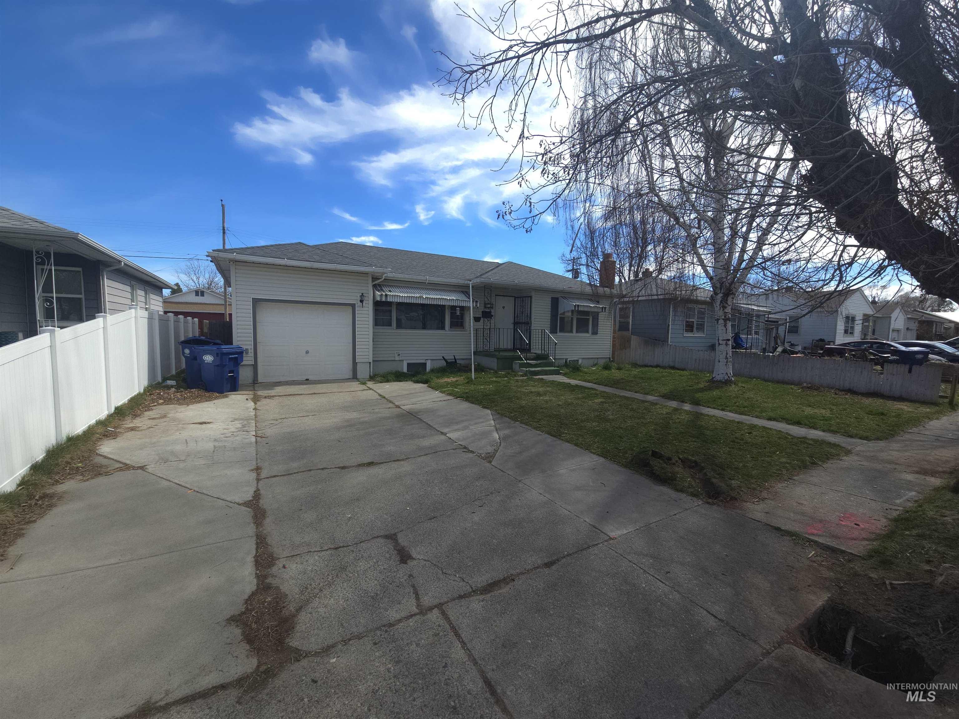 458 Rose Street North Twin Falls, ID 83301 - Photo 2 of 17 Single story home with driveway and a garage