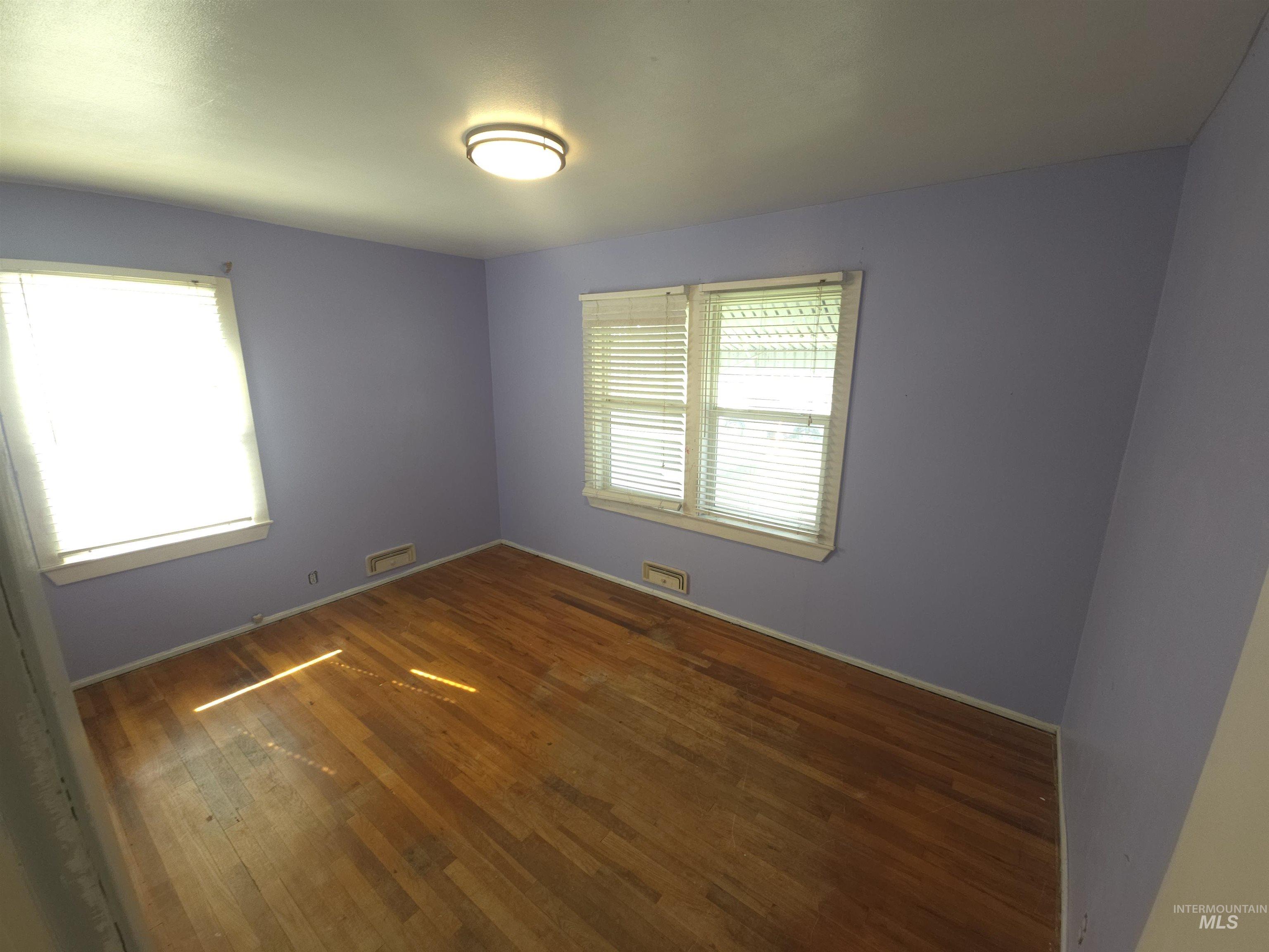 458 Rose Street North Twin Falls, ID 83301 - Photo 6 of 17 Spare room with dark wood finished floors and baseboards