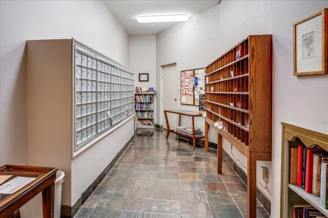 a view of room with stairs and wooden floor