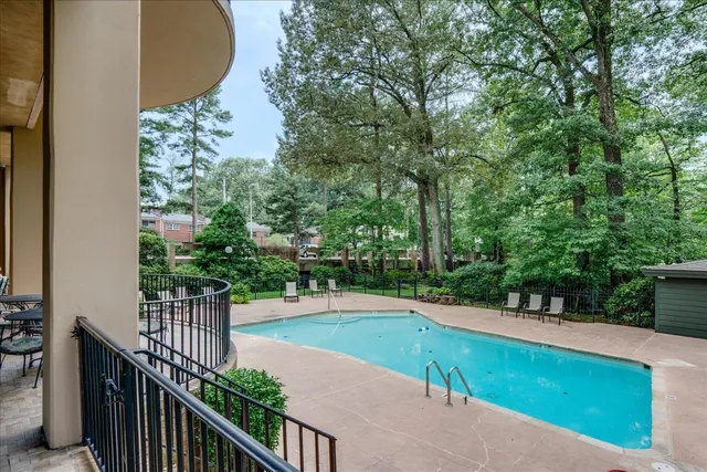 a view of a swimming pool with a patio