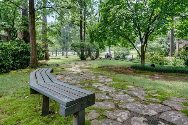 a view of a backyard with a sitting area