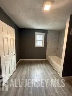 a bathroom with a bathtub and a sink