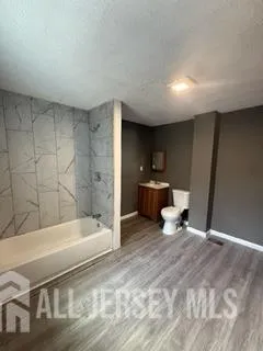 a view of gallery with wooden floor