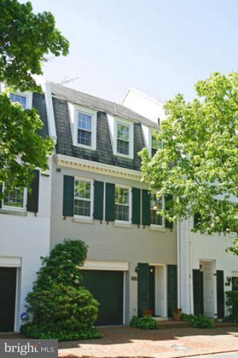 3318 R Street Northwest Washington, DC 20007 - Photo 1 of 26 a front view of a house with a garden