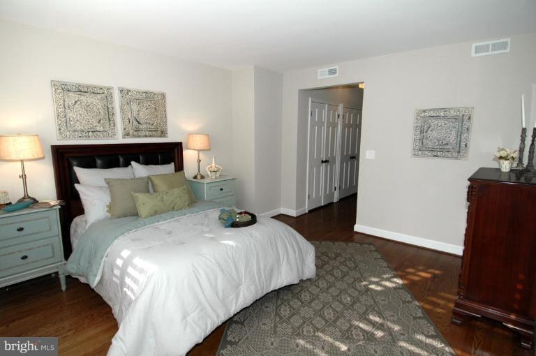 3318 R Street Northwest Washington, DC 20007 - Photo 11 of 26 a bedroom with a bed and a flat screen tv