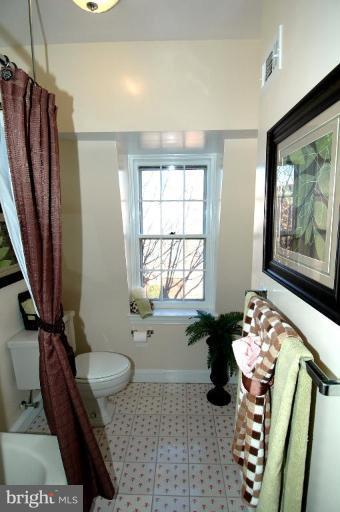 3318 R Street Northwest Washington, DC 20007 - Photo 13 of 26 a bathroom with a bathtub sink and mirror