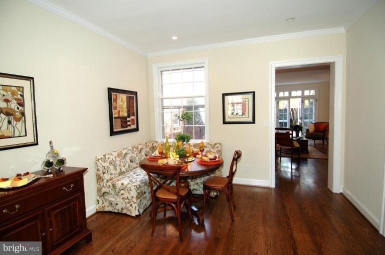 3318 R Street Northwest Washington, DC 20007 - Photo 17 of 26 a view of a dining room with furniture and wooden floor