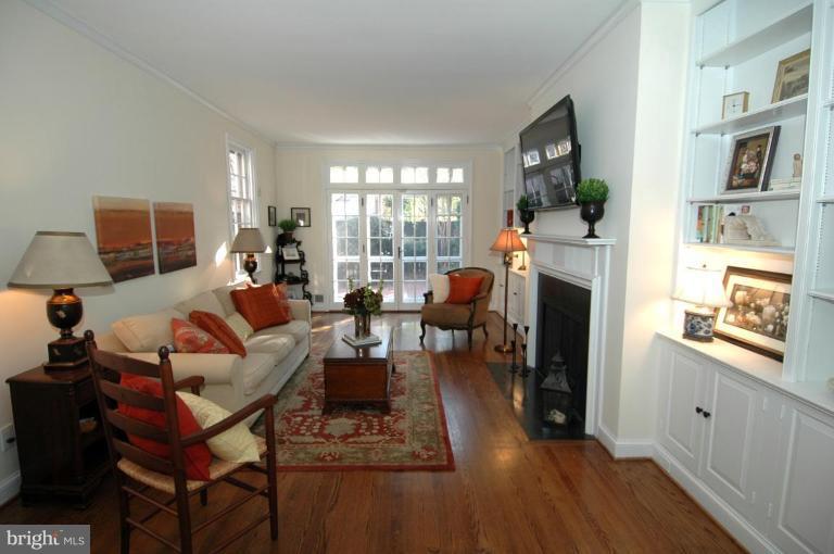 3318 R Street Northwest Washington, DC 20007 - Photo 3 of 26 a living room with furniture a flat screen tv and a fireplace