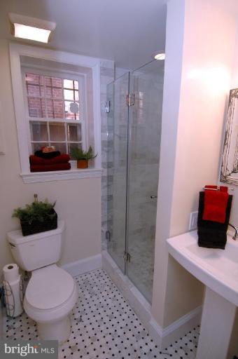 3318 R Street Northwest Washington, DC 20007 - Photo 23 of 26 a bathroom with a toilet and a shower