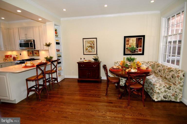3318 R Street Northwest Washington, DC 20007 - Photo 8 of 26 a view of a dining room with furniture and wooden floor