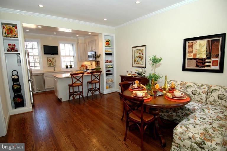 3318 R Street Northwest Washington, DC 20007 - Photo 9 of 26 a view of a dining room with furniture and wooden floor