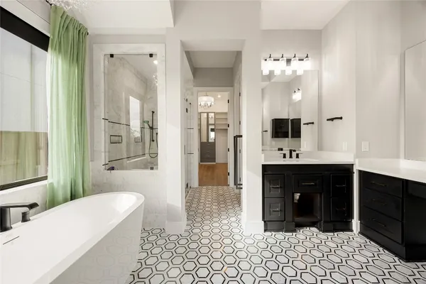 a large bathroom with a double vanity sink and a mirror