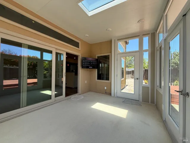 a view of a building with floor to ceiling window and an outdoor space