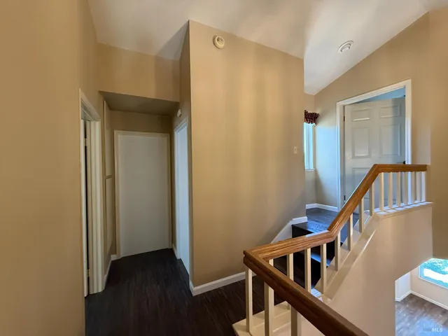 a view of an entryway with wooden floor
