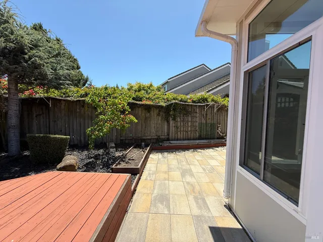 a view of a backyard with sitting area