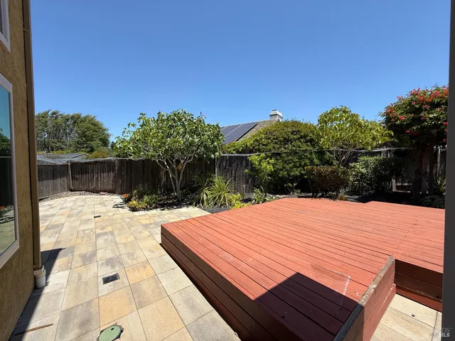 a view of a backyard with sitting area