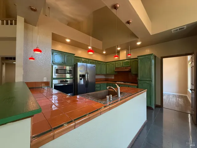 a lobby with furniture and a flat screen tv