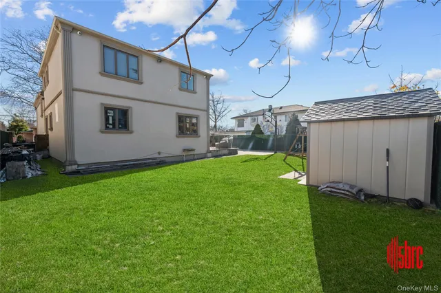 a view of a backyard with sitting area
