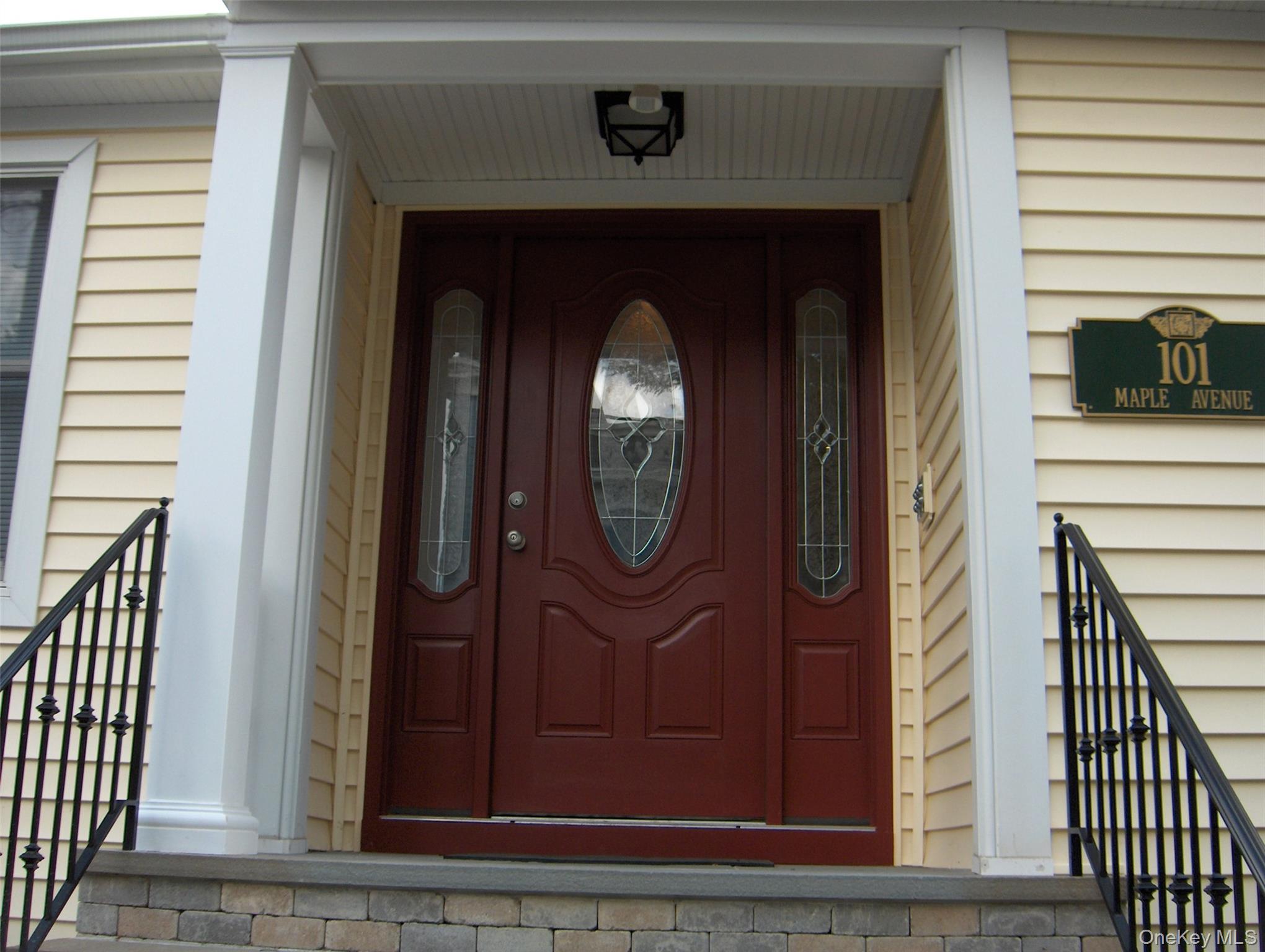 101 Maple Avenue Sea Cliff, NY 11579 - Photo 1 of 9 a front view of a house with grey door