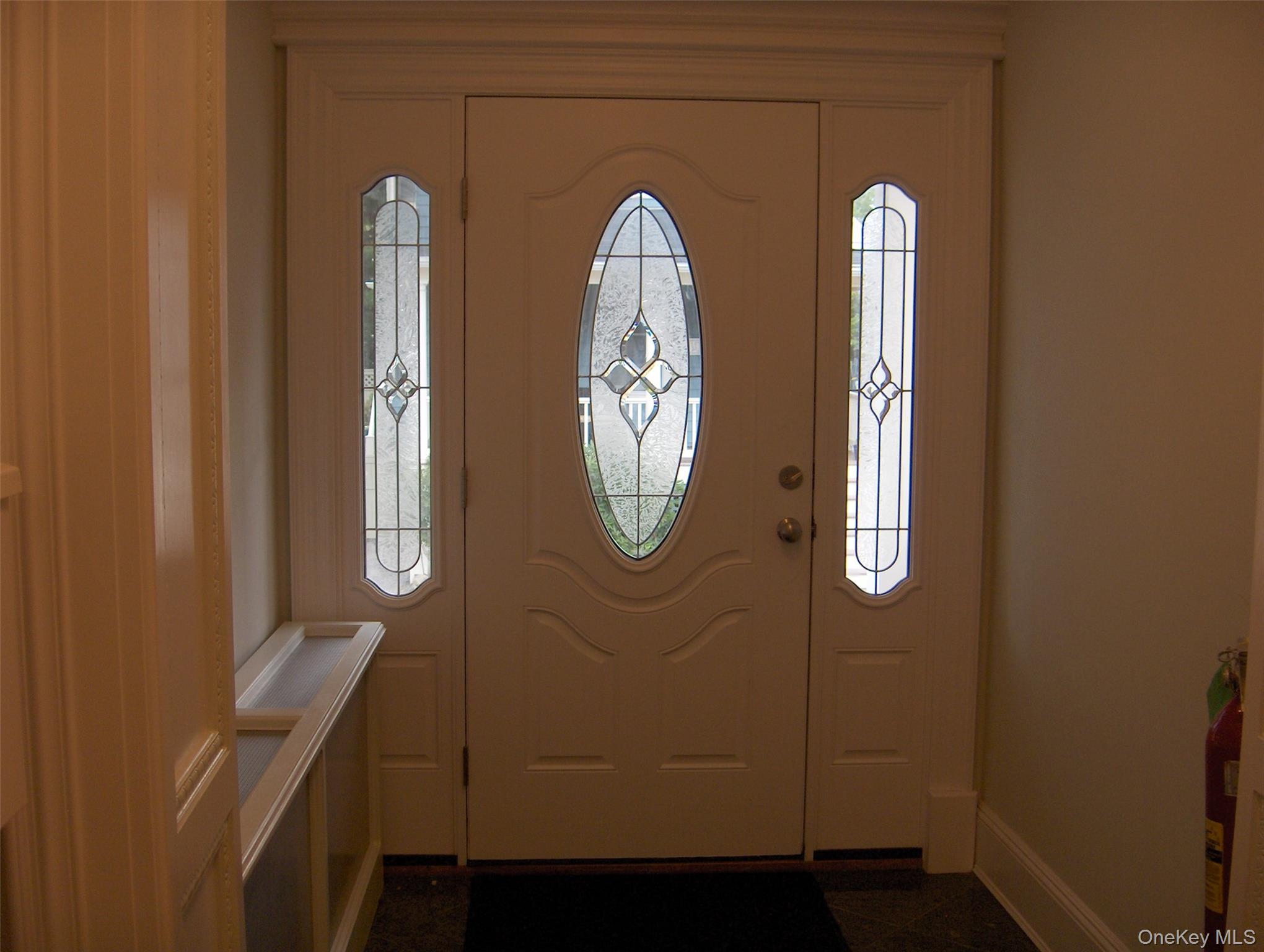 101 Maple Avenue Sea Cliff, NY 11579 - Photo 2 of 9 a front view of a house with wooden floor and windows