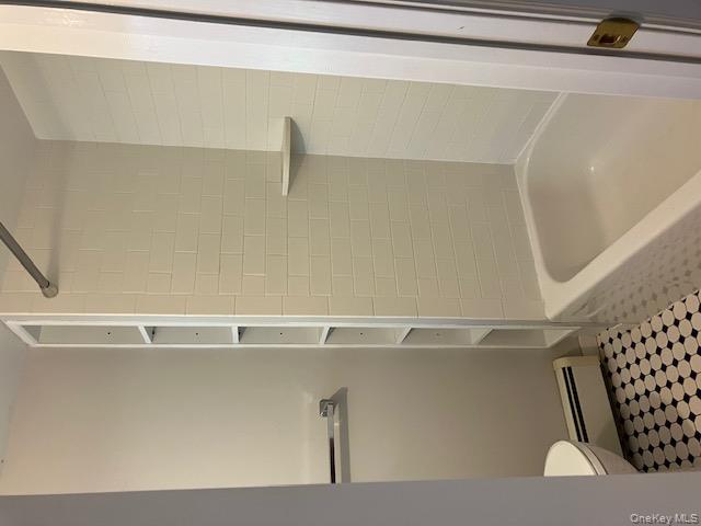 101 Maple Avenue Sea Cliff, NY 11579 - Photo 9 of 9 a bathroom with a granite countertop toilet and a bathtub