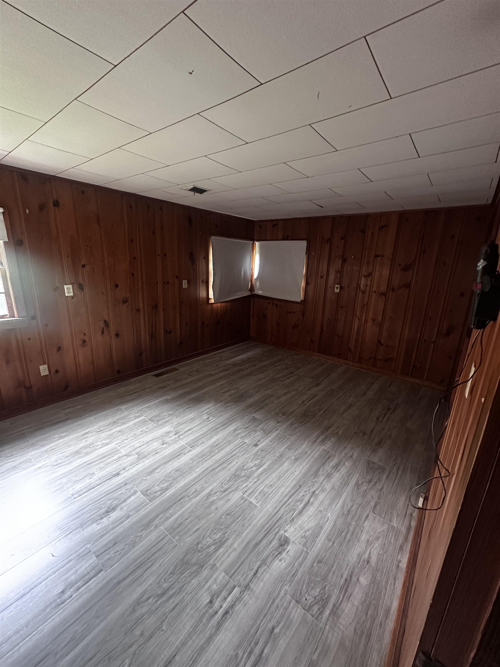 1865 Bartlett Road Memphis, TN 38134 - Photo 25 of 26 a view of an empty room with wooden floor and a window